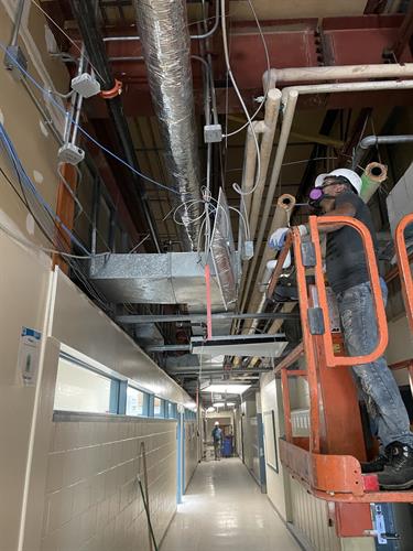 HVAC duct cleaning and repairs at a public school