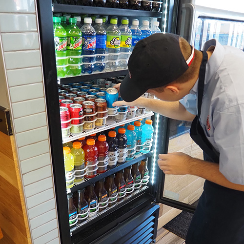 A student learns job skills by working part time at a local business with support from Birchtree's staff.