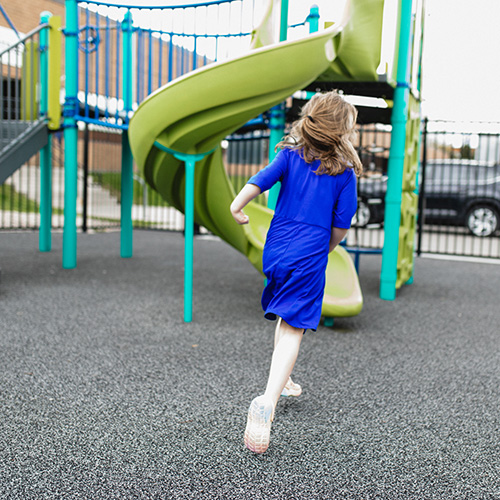 A student enjoys the playground at Birchtree's day school.