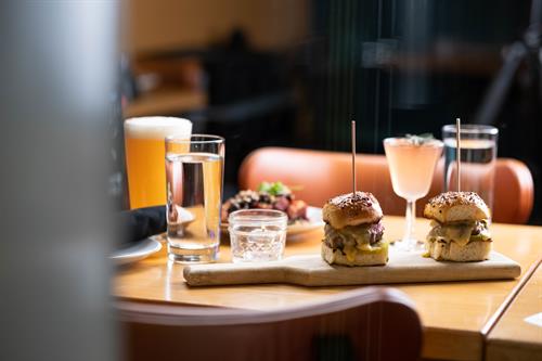 Sliders, cocktail, and beer at Moxy restaurant