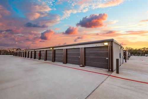 picture of big drive up units with sunset in background