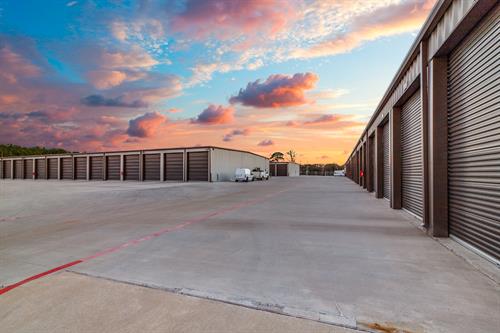 drive-up units with sunset in background