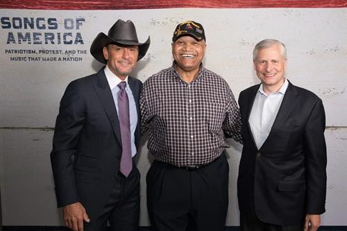 Dr. Hayles with Tim McGraw and Jon Meacham