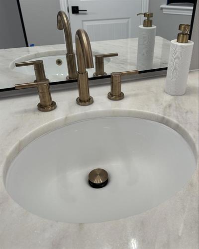 Supplied and installed bathroom sink faucet for remodel.