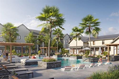 Our luxury pool deck featuring tanning ledges, plush seating, and 2 gas grills. 