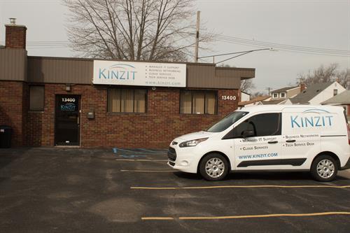 Gallery Image Kinzit_Front_Sign_with_Van_Parking_lot.jpg