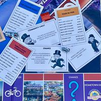 TABULA RASA ESSENTIALS GIVES BACK TO TDP WITH PURCHASE OF MANHATTAN BEACH EDITION OF MONOPOLY GAME