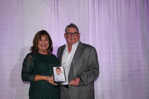 2019 President Lynda Walker presents Billy Chapman with the Navarre Realtor® of the Year award.