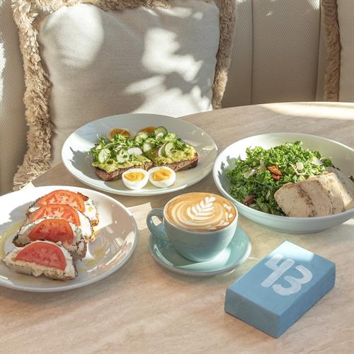 Brunch with Avocado Smash Toast, Tomato Bagel, Kale Caesar Salad, Almond Latte Brunch with Avocado Smash Toast, Tomato Bagel, Kale Caesar Salad, Almond Latte