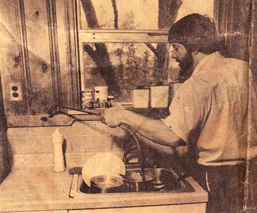 David M. Parker servicing a client's home in the 1970s, the early days of his business.