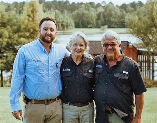 Two generations of the Parker Family: Caleb Parker (L) with his parents, Beverly and David.