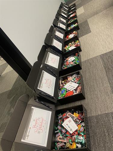 We like for our customers to know we value and appreciate them so we took the time to custom make them something special! These are hand crafted mini laptop boxes filled with candy, pens, and business cards.