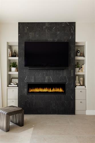 Living Room fireplace with etched marble facade, furnishings and shelf styling
