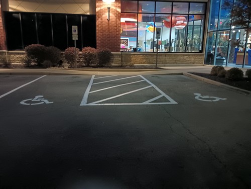 Fresh ADA striping insures everyone knows these spots are reserved.