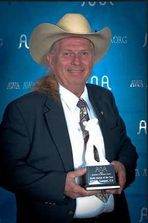Mike Day receiving "Radio Station of the Year" award from the Academy of Western Artists.