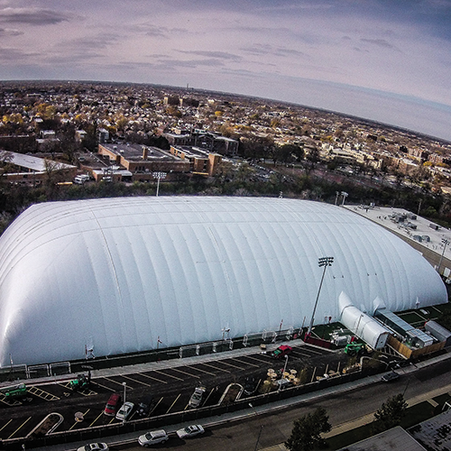 Between December and April, we erect an air-supported dome over our fields, transforming our space into a brightly lit, temperature-controlled indoor facility.