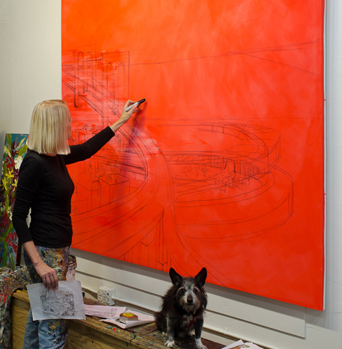 Gallery Artist Sue Averell working on a large urban landscape painting.
