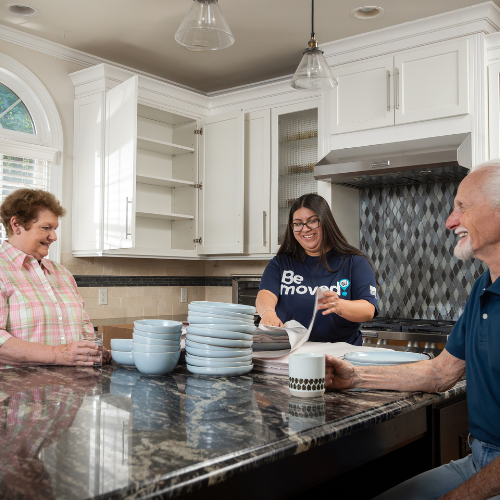 Wirks packer visits with family while packing kitchen