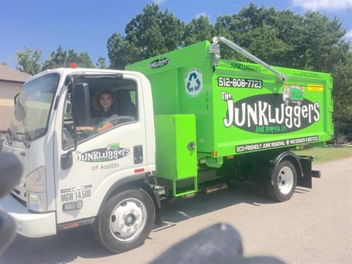 Owner Laura Chavez behind the wheel - Junk removal Austin