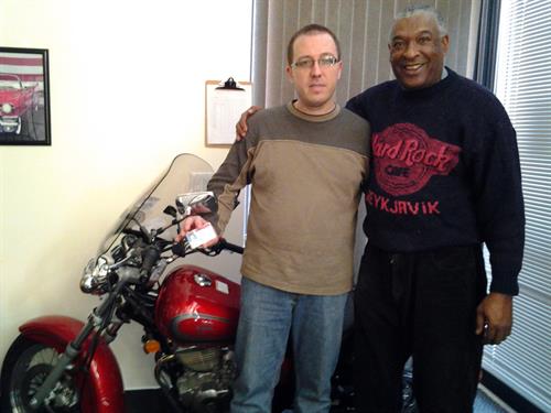 Reggie the instructor on the right with one of our students of the motorcycle program