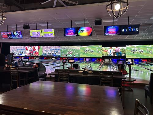 Main set of lanes with football games across our 121 ft LED video wall