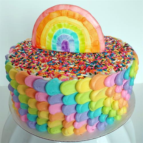 Custom rainbow birthday cake with sugar cookie topper