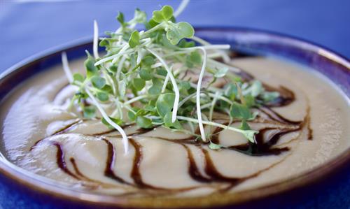 1/24/25 Partake Lounge: Cauliflower Bisque: Roasted cauliflower, leeks, carrots, celery, onions, garlic & vegetable stock. Garnished with balsamic reduction and micro greens. *GF *V