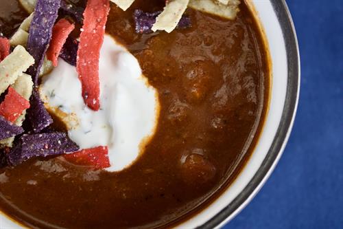 1.29.25 Partake Lounge: Beef & Chili Soup: Roasted, braised beef chunks, spicy and mild peppers, onions, garlic, and chicken stock, garnished with lime, cilantro & sour cream. *GF