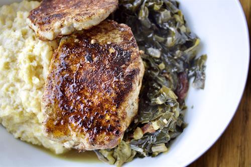 1.29/.5 Partake Lounge Supper Special: Pan-seared southern-inspired pork chops, creamy polenta & bacon braised collard greens. *GF