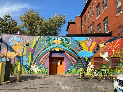 This mural on the rear of the school building represents the school's arts-integrated curriculum and commitment to creative instruction.