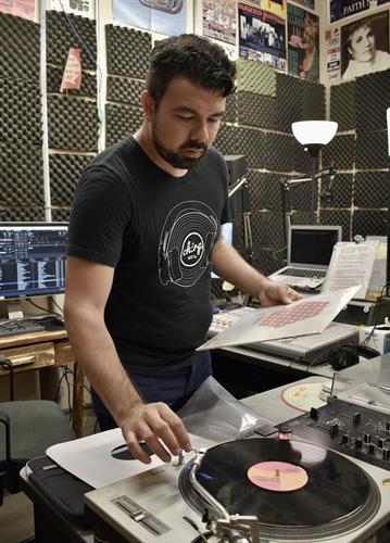 DJ Eddie cues a record