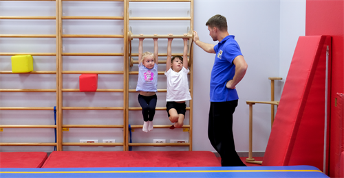 Climbing the wooden wall bars
