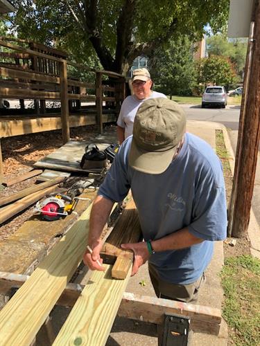 Repairing accessible ramp at Our House 2021