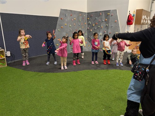 Students enjoying movement and active play in the indoor learning space at Quantum STEM School.