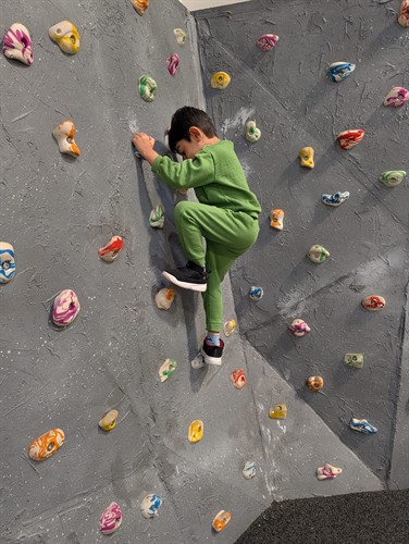 Students build strength, coordination, and confidence on the indoor climbing wall at Quantum STEM School.