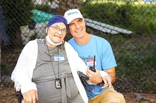 Volunteer Gabe poses with 93-year-old Thelma, at IDignity to obtain her birth certificate