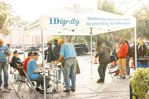 Volunteers check clients in during one of IDignity's Identification Service Days. 