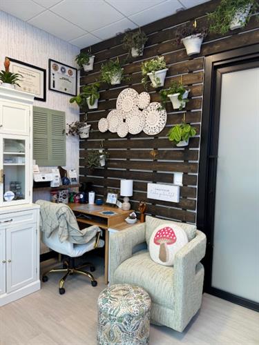 Intake chair surrounded by the wall of plants