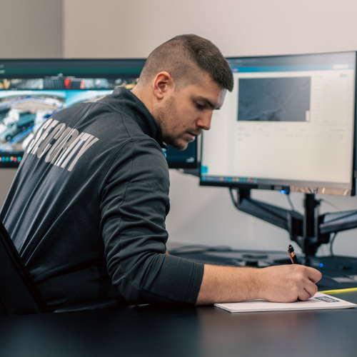 Trained security staff monitoring camera