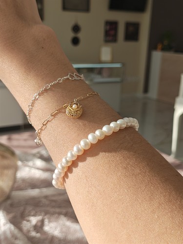 Permanent Jewelry Bracelets and Button Pearl Bracelet