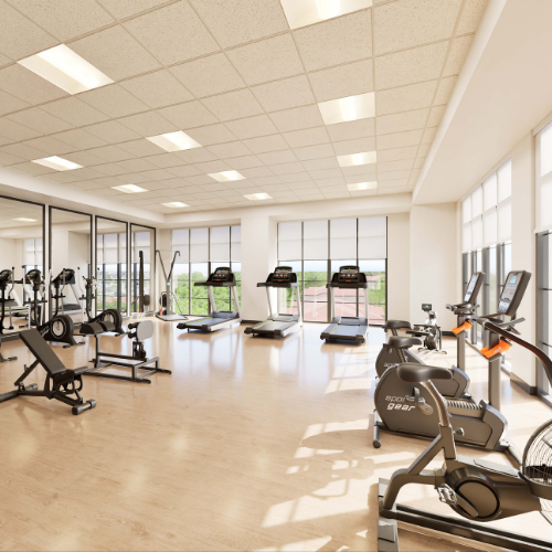 The fitness center is designed with modern strength-training equipment to support active, healthy living in an energizing environment.