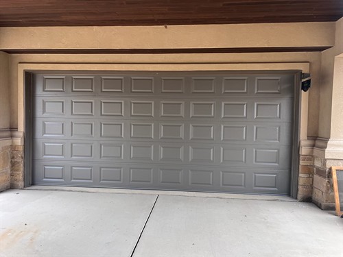 Model 2250 C.H.I. garage door short raised panel design in brown. Garage Door Specialists