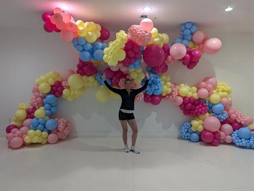 Nothing better than being surrounded by celebration! A perfect moment under a beautiful balloon arch. 