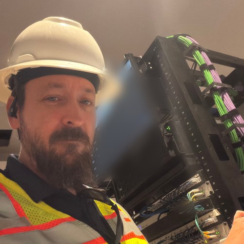 Jason Osborne, founder of SOHO Logics, on site installing network cabling