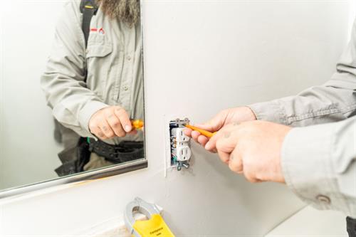 Gallery Image electrical_rewiring_in_Tucson_technician_with_screwdriving.jpg
