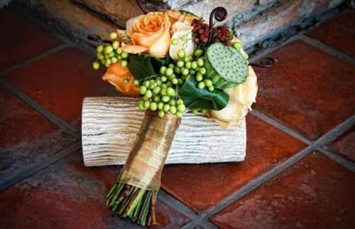 Pods, roses and berries make a beautiful bridesmaid's bouquet!