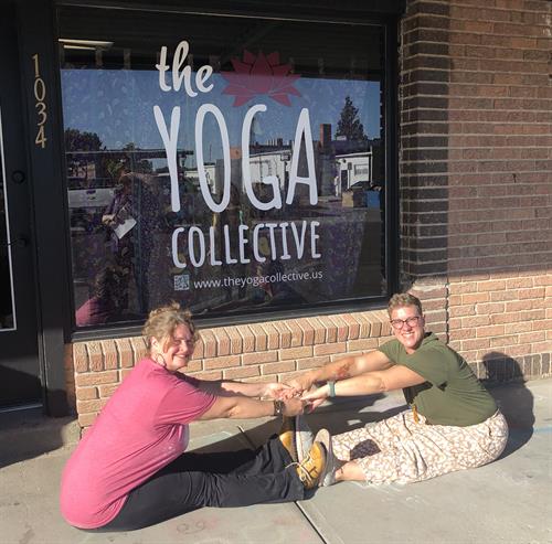 Owners Lisa Betz-Marquez and Desarie Evelo in front of the yoga studio.