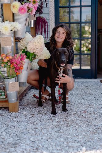 Owner, Sara, and her shop dog Milo