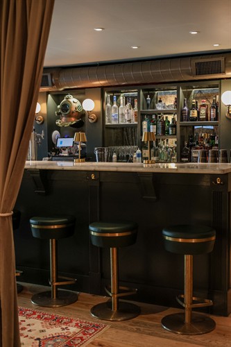 Head downstairs to Siren for cocktails, beer, and wine.