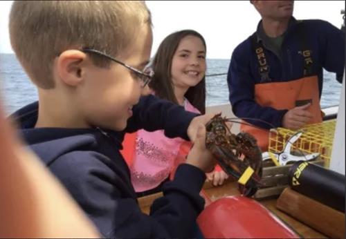 Children enjoying the lobster boat tour